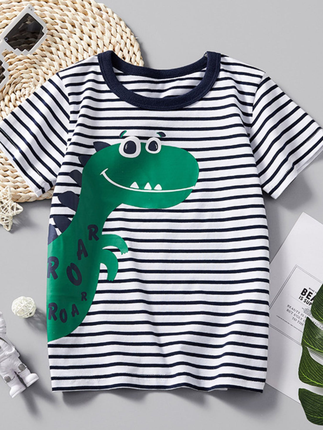 Toddler t-shirt with navy and white stripes, a green dinosaur graphic, and short sleeves.