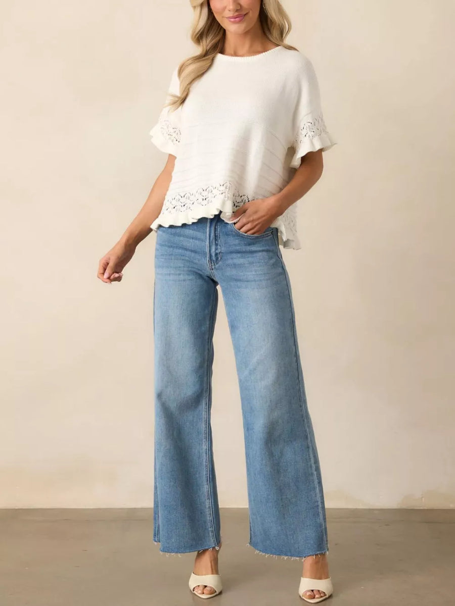 White knit top with crew neck, short sleeves, and delicate lace trim at hem and cuffs.