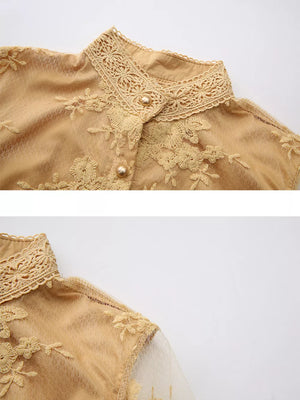 Gold lace-embellished maxi dress with button-down detail and high neck.