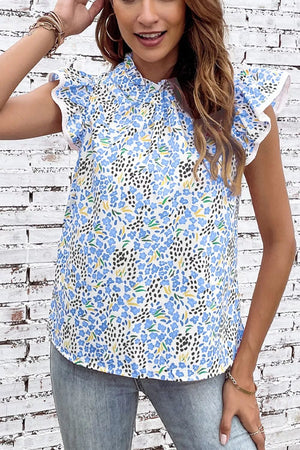 Floral abstract high neck blouse with cap sleeves and ruffled trim.