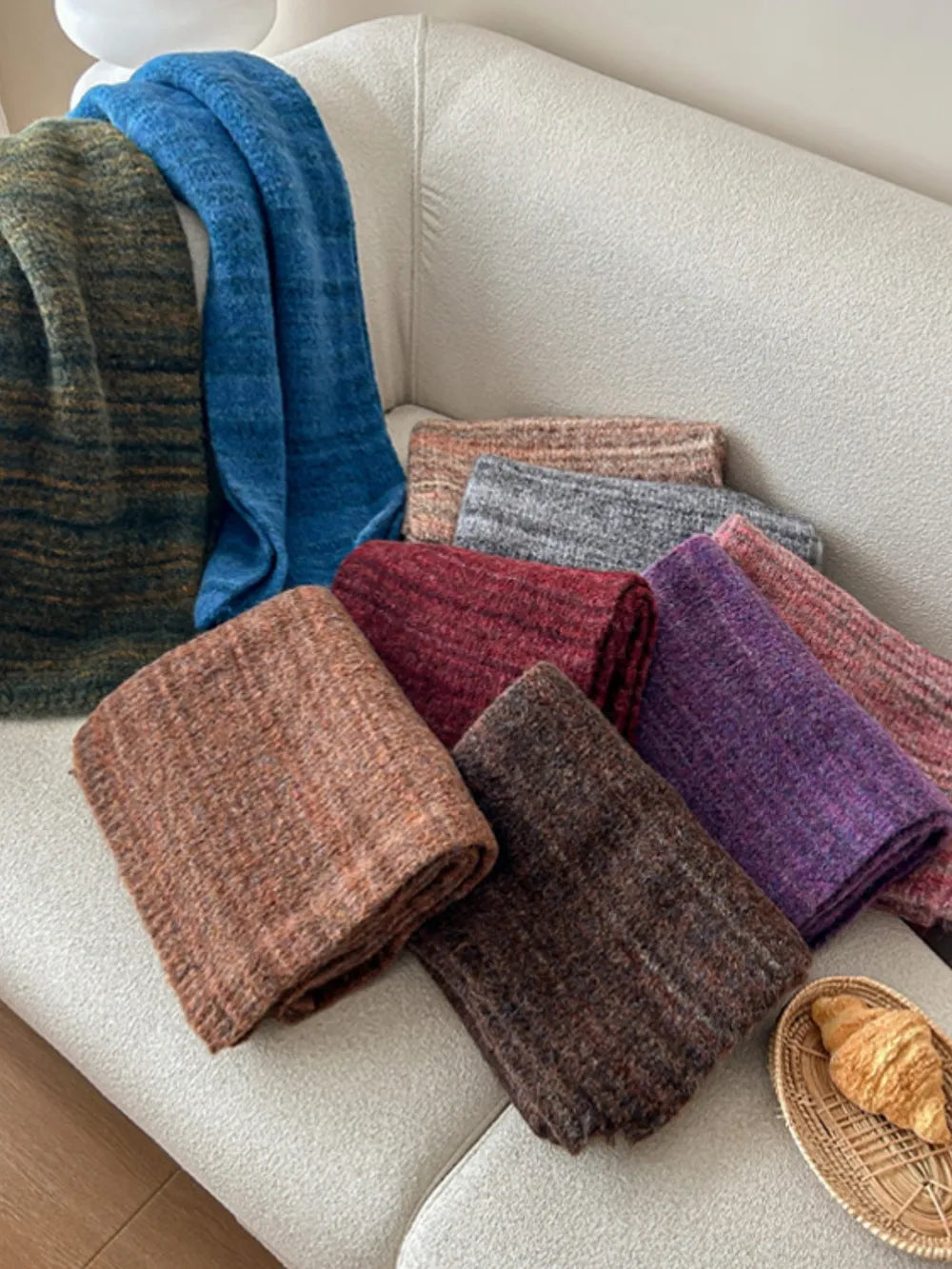 Textured mélange knit scarves in multiple colors including Royal Blue, Terracotta, Deep Purple, and Chocolate.