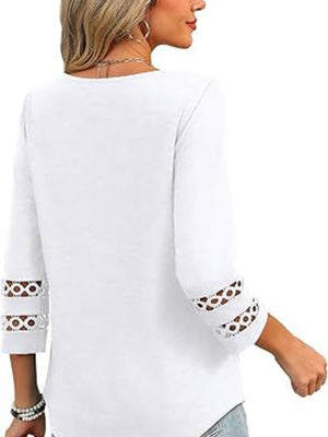 White 3/4 sleeve t-shirt with cutout detail on sleeves.