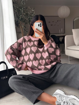 100% polyester Care instructions: Machine wash cold pullover sweater in Pink Brown with oversized silhouette