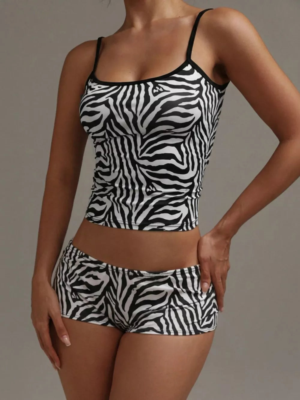 Women's zebra print pajama set with cami top and shorts.