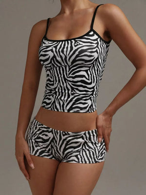 Women's zebra print pajama set with cami top and shorts.
