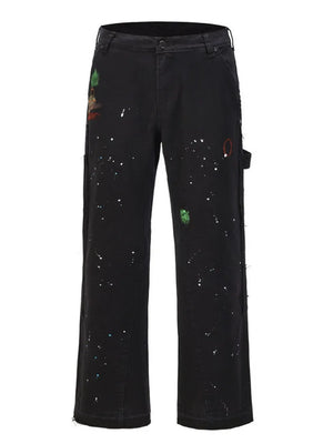 Black carpenter trousers with artisan paint splatters and bootcut leg.