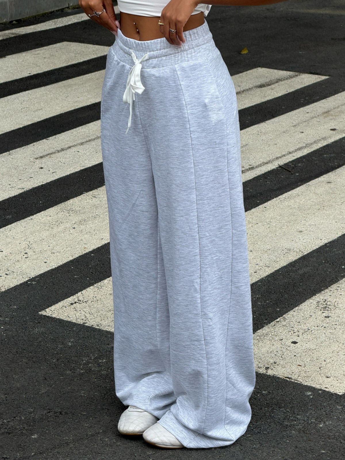 95% polyester, 5% elastane Care instructions: Machine wash cold wide-leg pants in Gray/white with loose silhouette