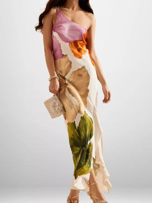 Elegant floral one-shoulder maxi dress in polyester with a high slit and ruffled hem.