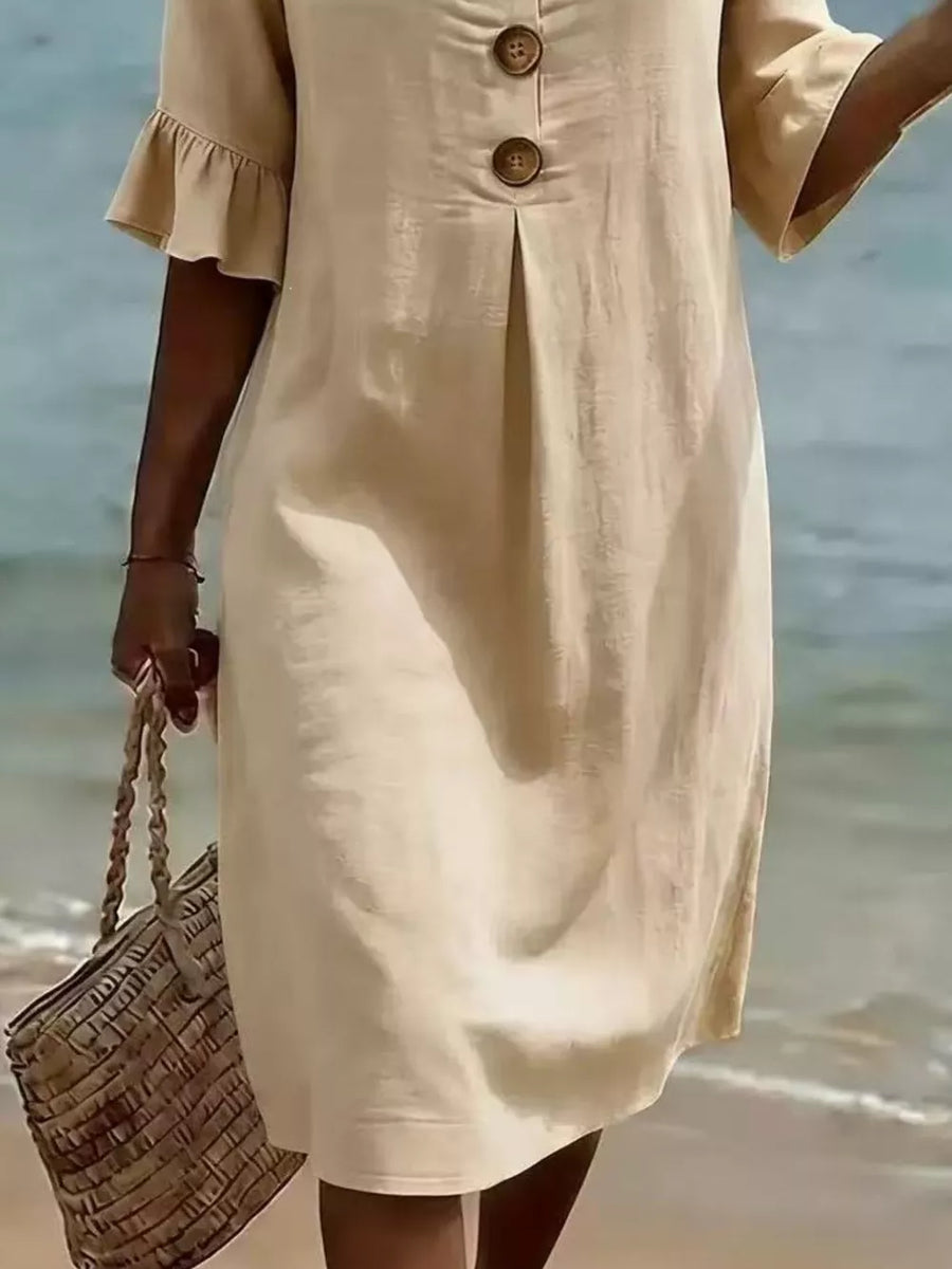 Khaki linen dress with ruffled sleeves, button detail, and a pleat.