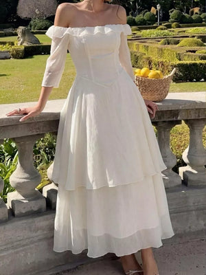 Elegant cream off-shoulder midi dress with ruffled neckline and tiered skirt