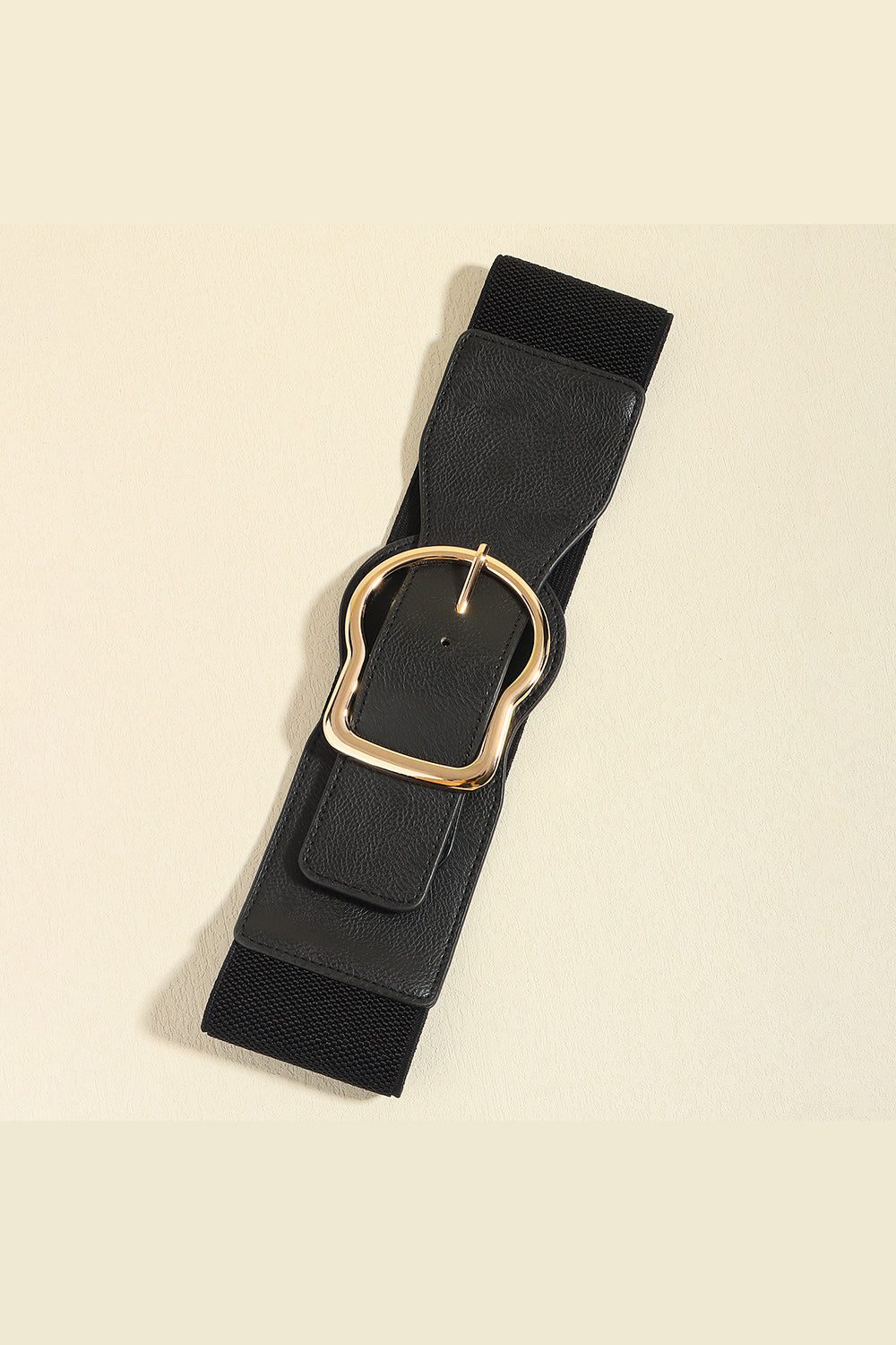 Black elastic belt with a sculpted faux leather overlay and gold buckle.