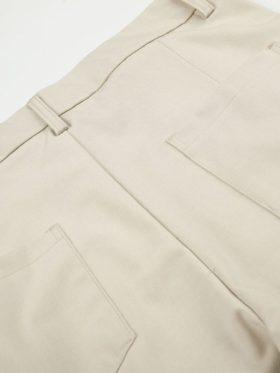 Men's High-Waisted Pleated Wide-Leg Pants in cream with pleated front