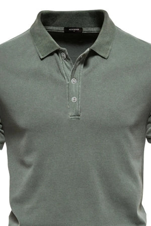 Sage green textured polo shirt with buttoned placket and spread collar.