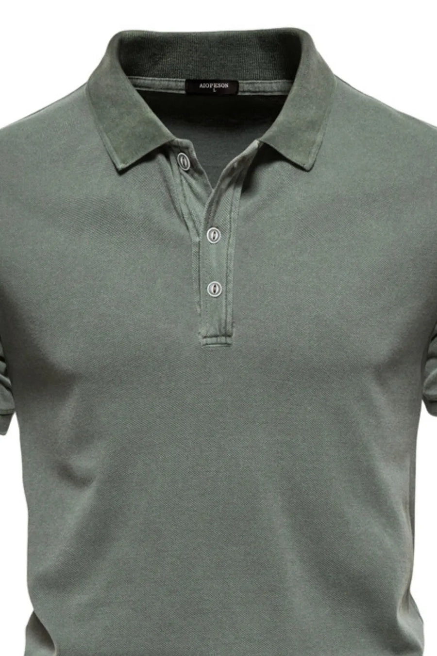 Sage green textured polo shirt with buttoned placket and spread collar.