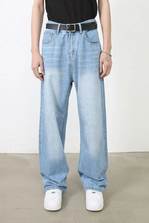 Faded light blue denim baggy jeans with a relaxed fit and casual style.