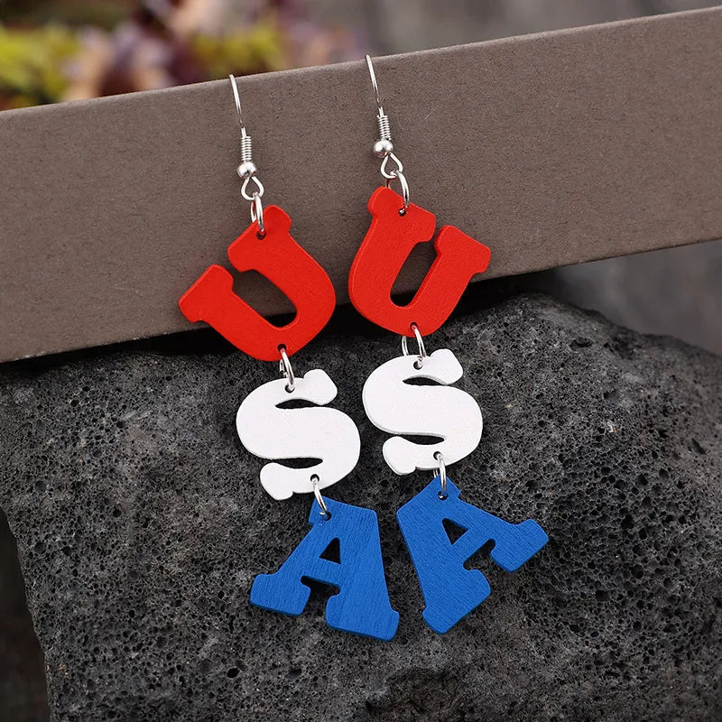 Patriotic USA letter drop earrings in red, white, and blue alloy.