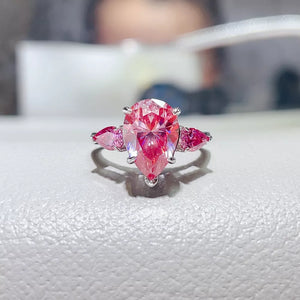 ring in pink featuring teardrop cut stones and ring fit