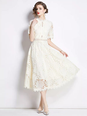 Elegant white lace midi dress with delicate sleeves and a-line skirt.