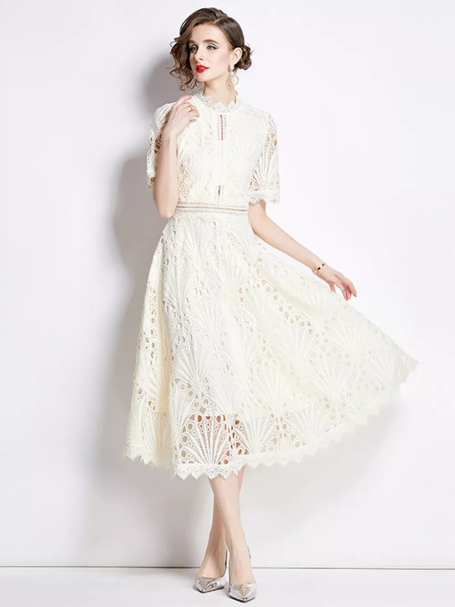 Elegant white lace midi dress with delicate sleeves and a-line skirt.