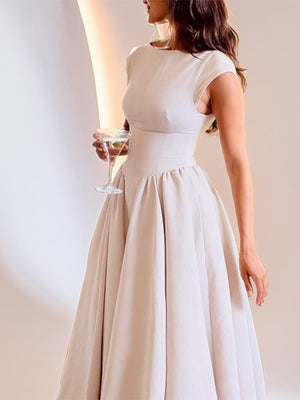 Beige A-line midi dress with cap sleeves and boat neck, full skirt.