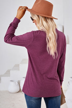 Henley button-down knit top in a heathered plum color with long sleeves.