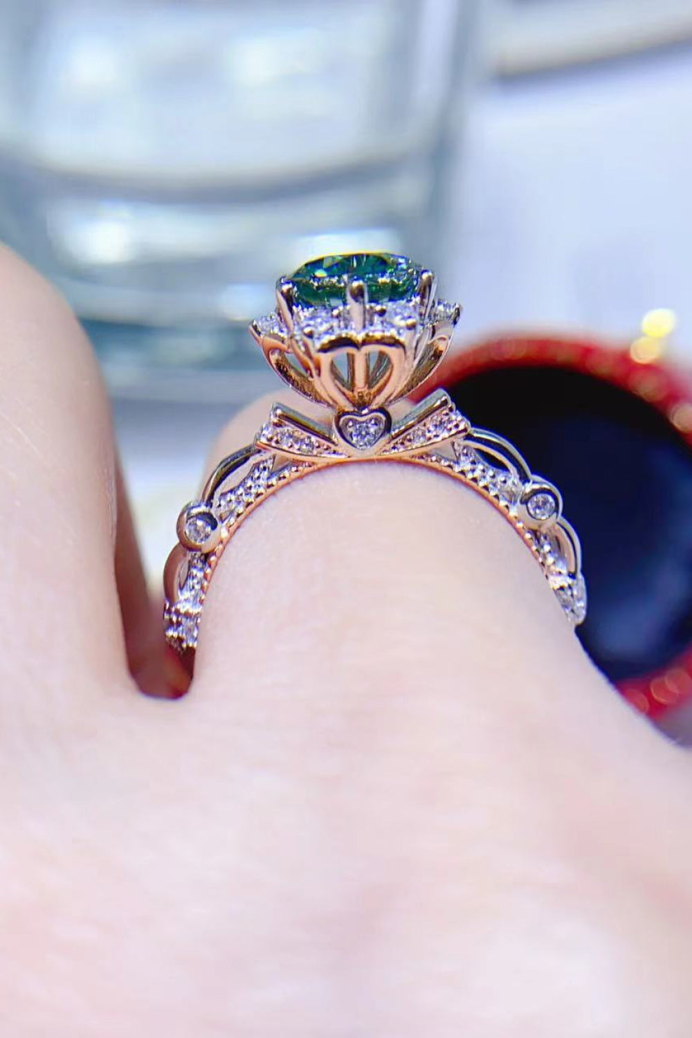 Emerald Bloom Moissanite Halo Ring in light green with pave diamond band and heart details.