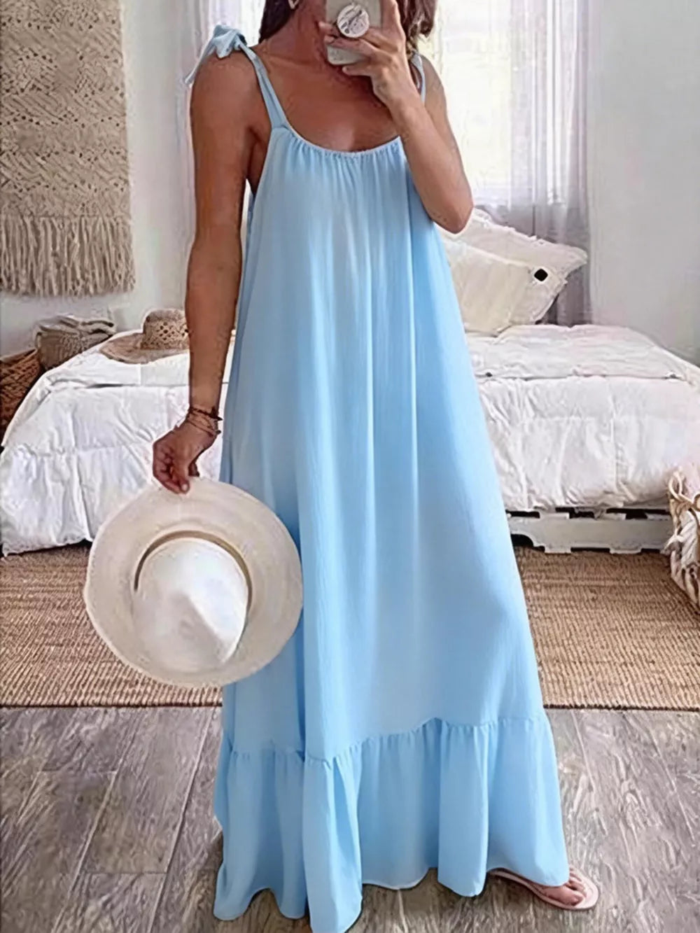 Sky blue maxi dress with tie straps and ruffled hem, a casual summer style.
