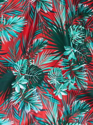 Chic floral midi dress with spaghetti straps in a tropical print.