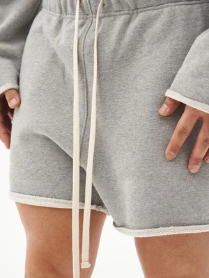 Gray fleece lounge shorts with raw edge hem and drawstring