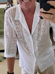 White crochet resort shirt with geometric pattern, button-up style, and 3/4 sleeves.