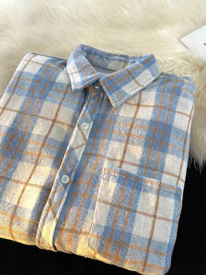 white button-up shirt featuring chest pocket and plaid