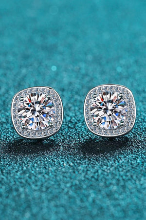 Silver cushion cut halo moissanite stud earrings with sparkling accents.
