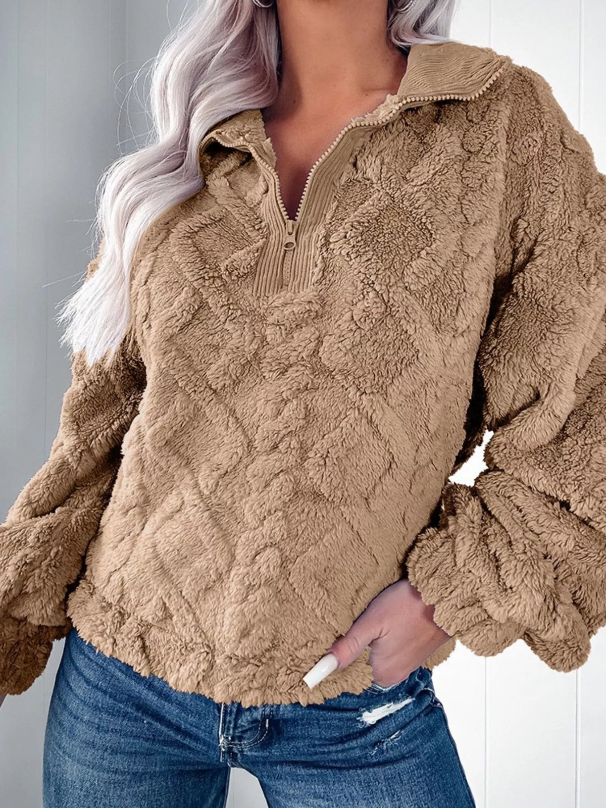 Textured fleece quarter zip sweatshirt in khaki with diamond pattern and ribbed collar.