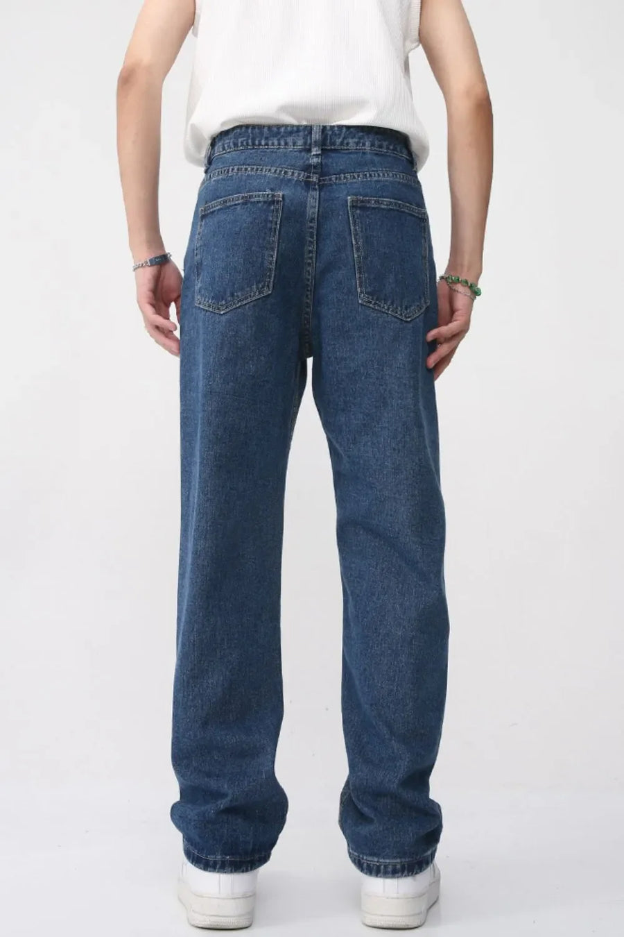 Faded wash baggy jeans in dark denim with a relaxed fit.
