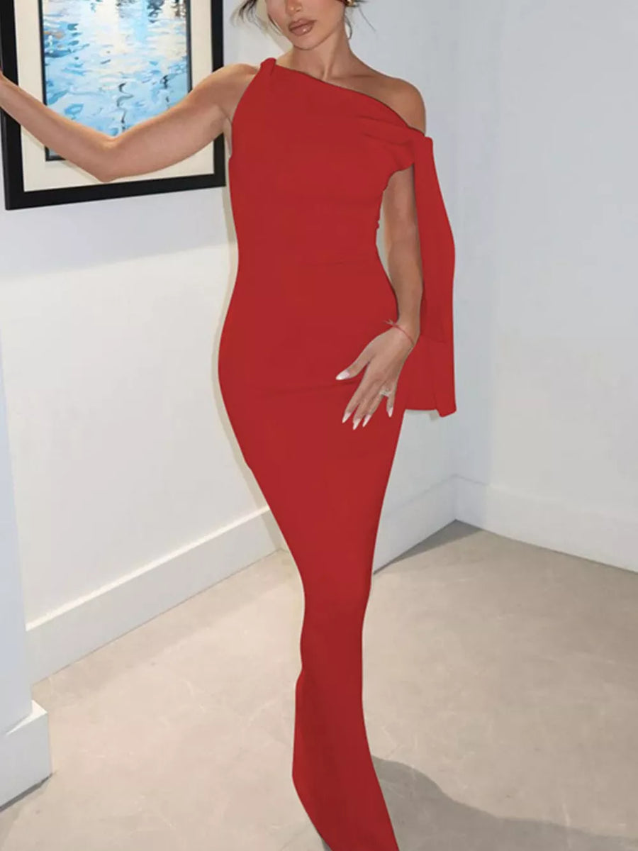 Red asymmetrical draped maxi dress with one shoulder and flowing sleeve detail.