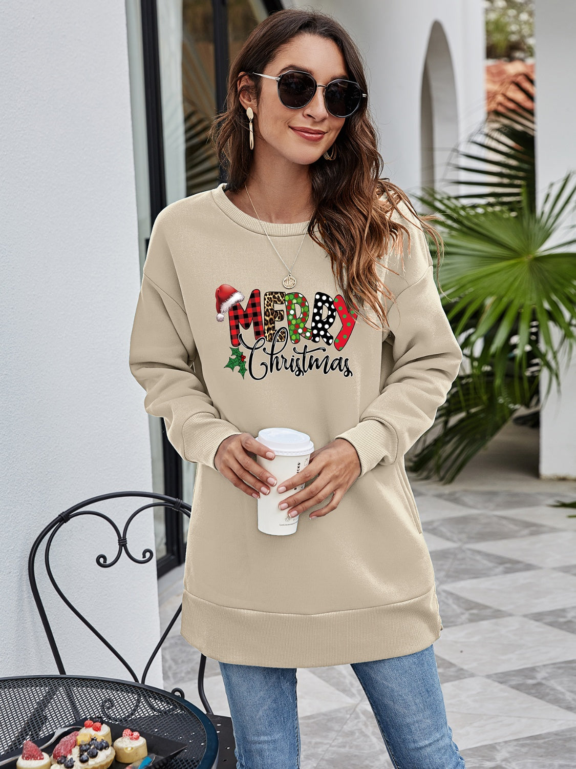 Beige tunic sweatshirt with Merry Christmas graphic, crewneck, long sleeves, and relaxed fit.
