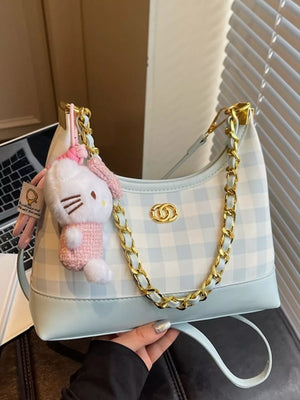 Pastel blue plaid shoulder bag with chain accent and Hello Kitty charm