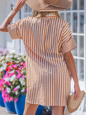 Striped V-neck shift mini dress in orange and white, with short sleeves and a collared neckline.
