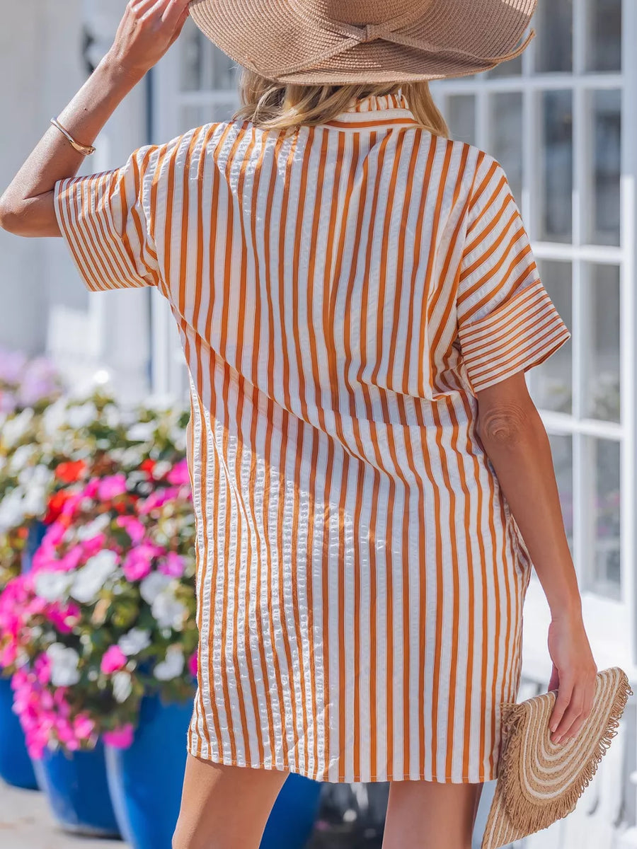 Striped V-neck shift mini dress in orange and white, with short sleeves and a collared neckline.