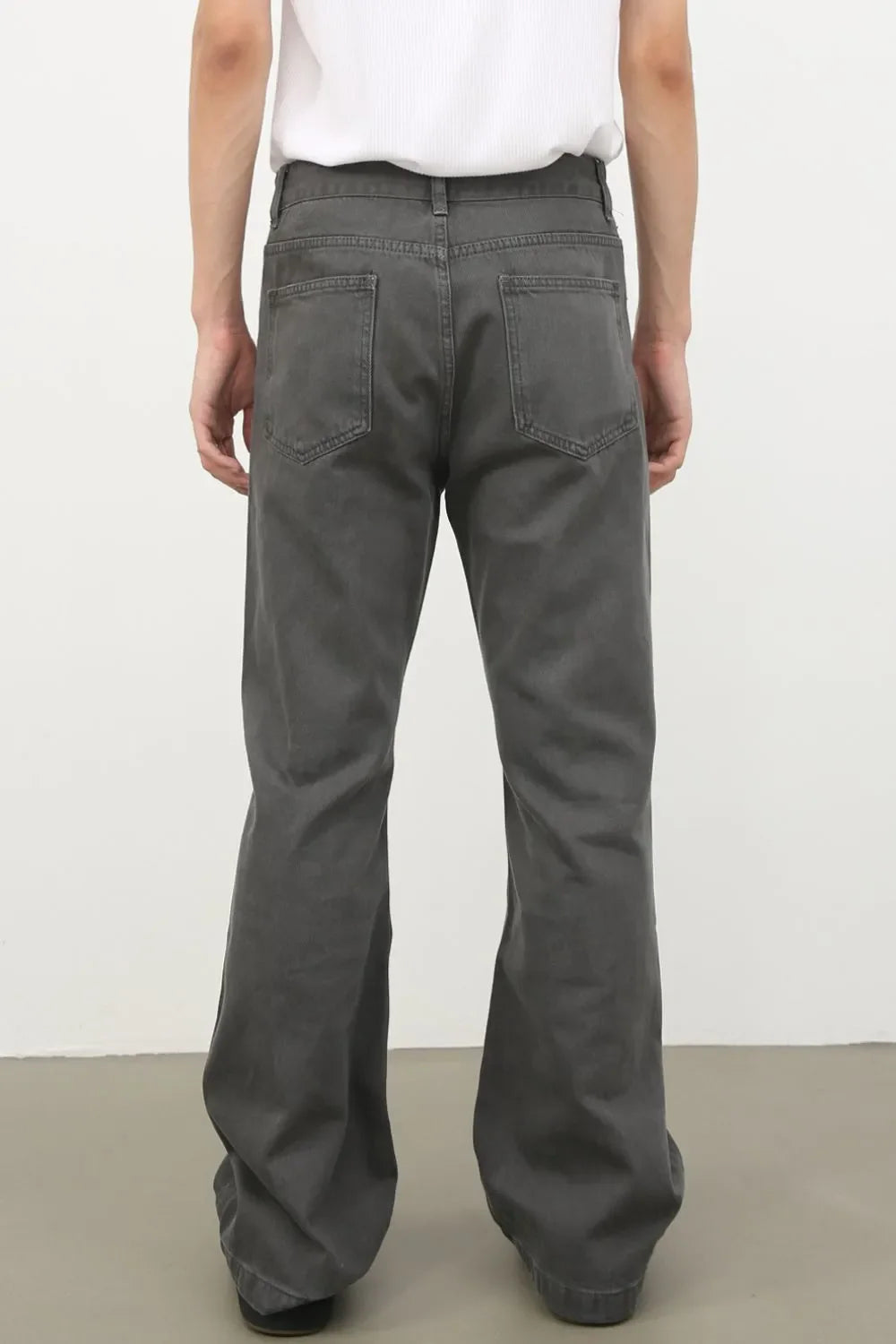 Dark gray washed denim wide-leg trousers with a relaxed fit and classic back pockets.