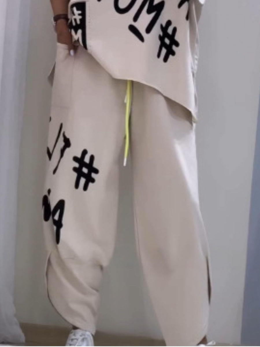 Khaki graphic tee and drawstring pants set with bold black lettering and hash symbols.