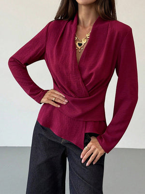 100% polyester Care instructions: Machine wash cold wrap top in burgundy with fitted silhouette