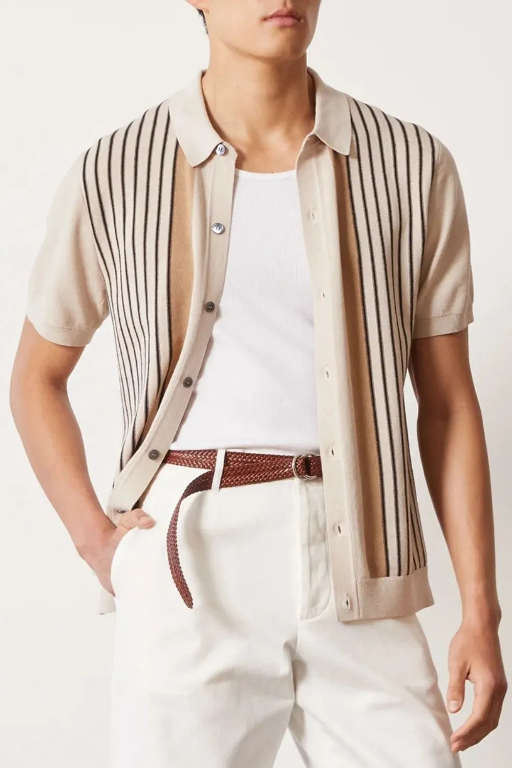 Beige knit polo shirt with vertical stripes and buttoned front.