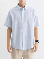Light blue cotton short sleeve button-up shirt with a classic collar.
