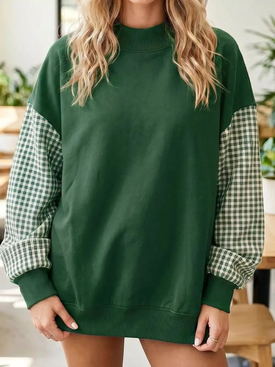 white sweatshirt featuring ribbed cuffs and gingham