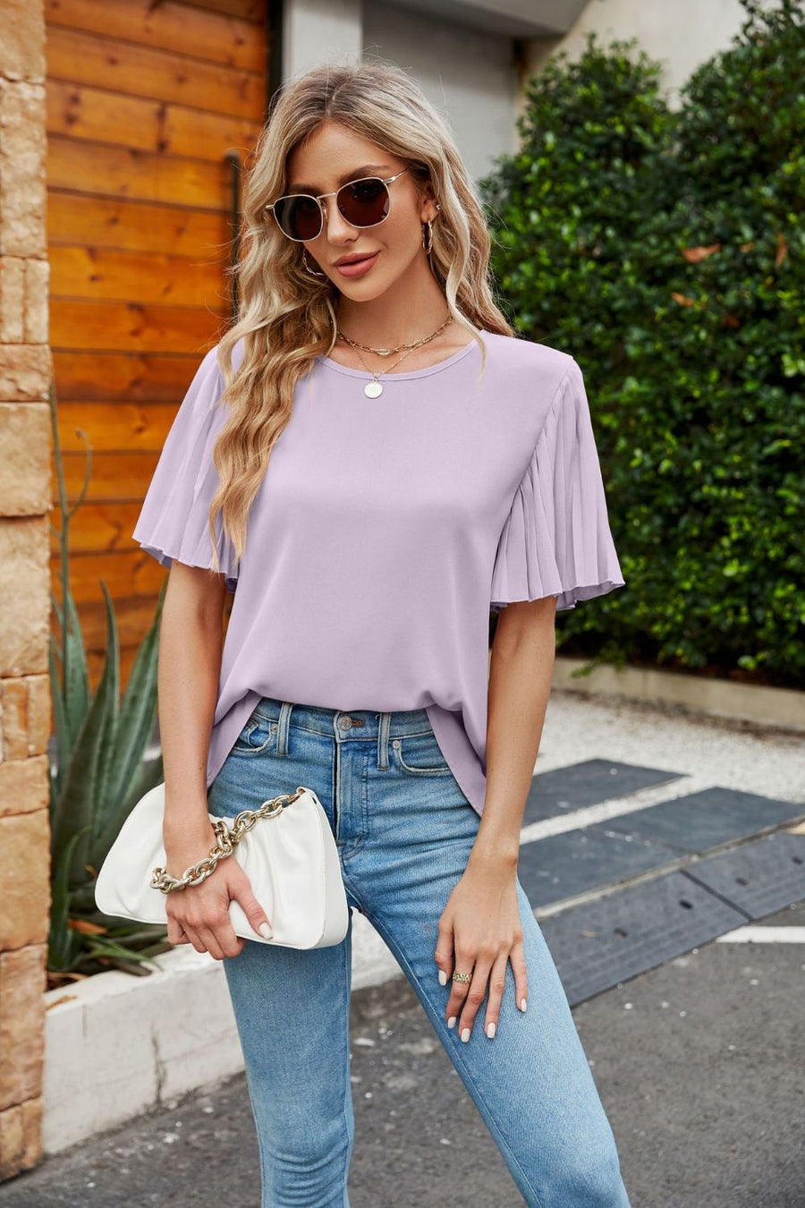 Lilac blouse with flounce pleat short sleeves and crew neck.