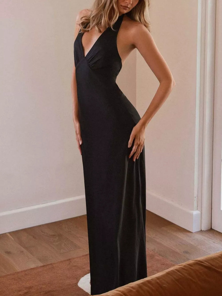 Black cotton backless halter neck maxi dress with deep V-neck.