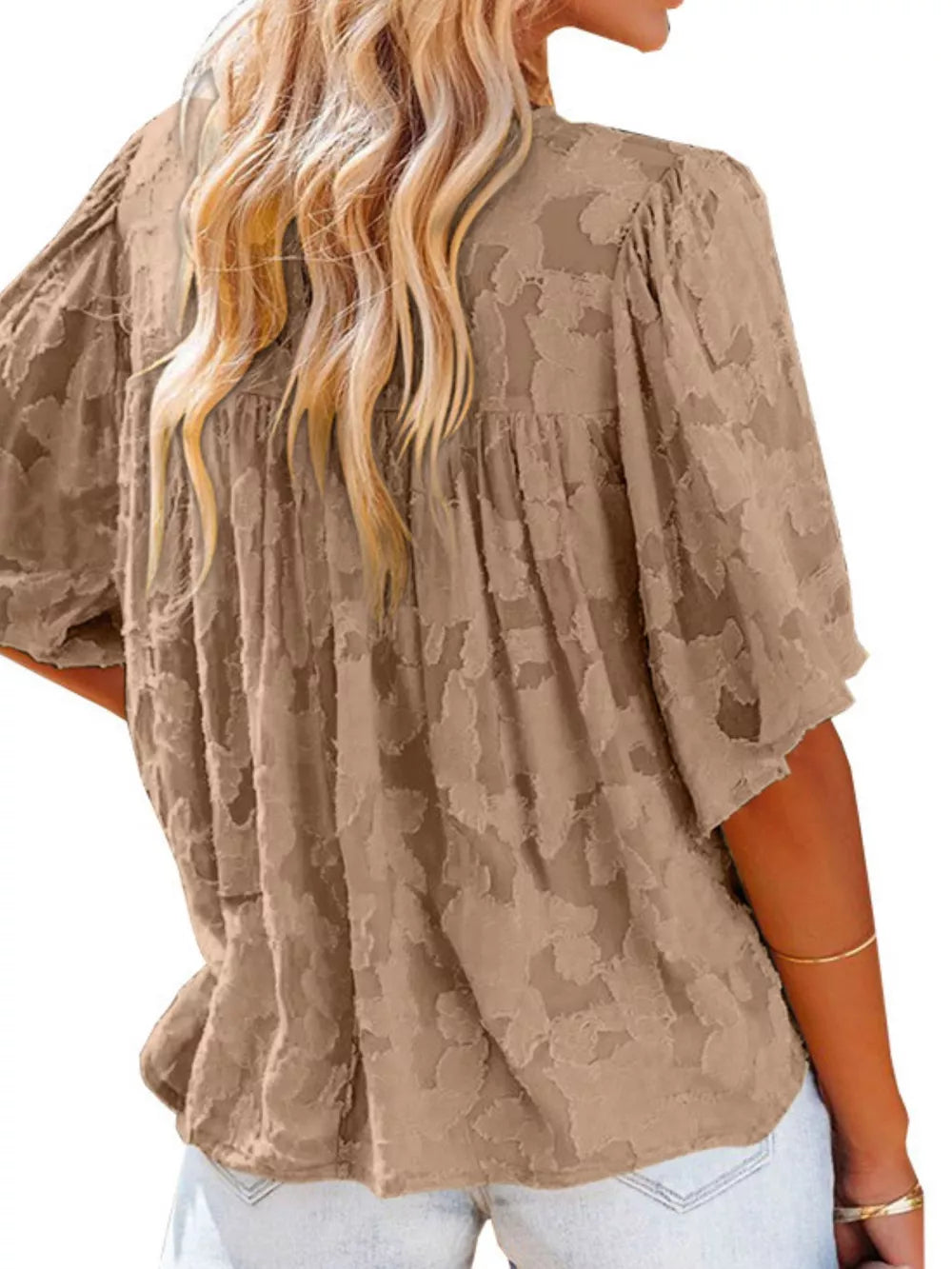Brown textured V-neck button-down blouse with ruffled detail and short sleeves.