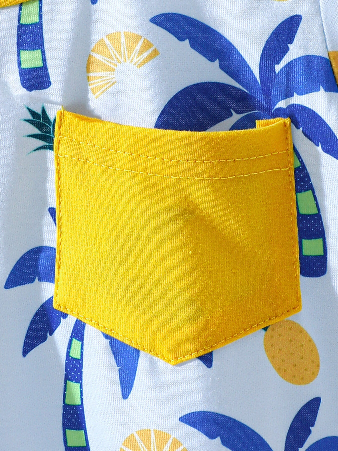 Baby tee and shorts set with tropical palm tree print and yellow pocket detail.