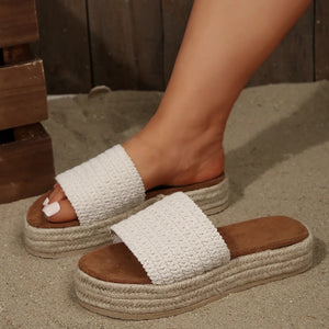 Crochet detail espadrille platform slides in beige with a white woven strap and brown footbed.